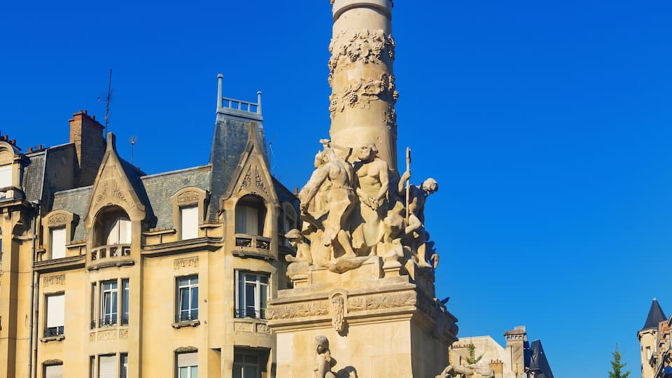 Beautiful sky and fountain Sube with golden angel at Reims central Erlon square in city center, Reims. France