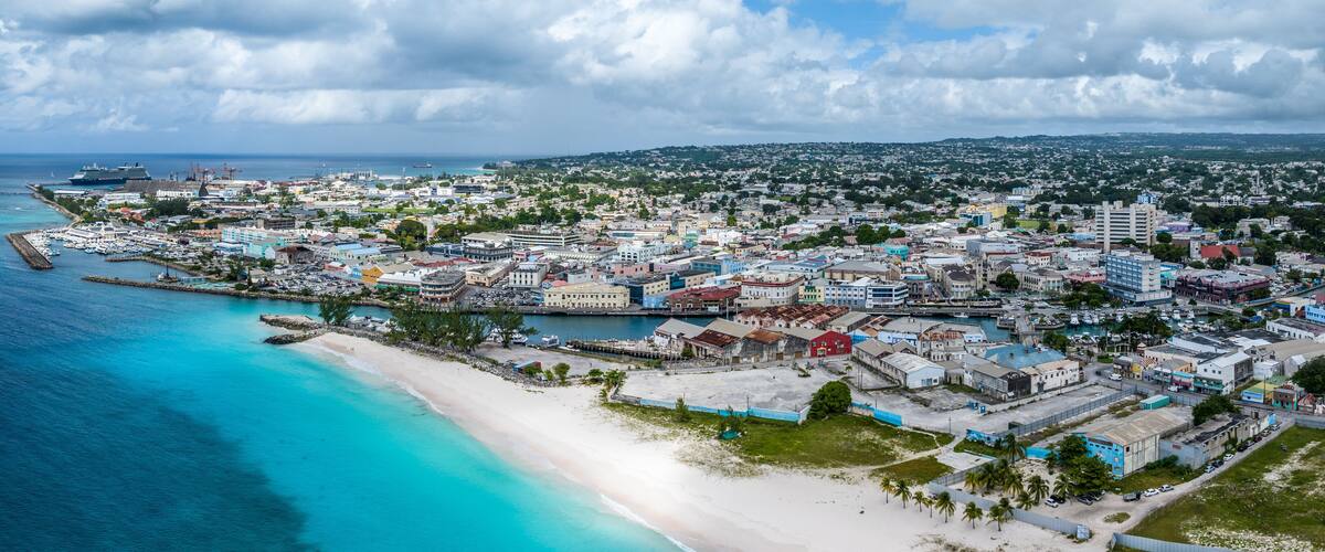 Aerial landscape view of Bay Area of Carlisle Bay at Bridgetown, Capital of Barbados with Brownes Beach in front and central City of Bridgetown, (Saint Michael) and Cruise Port Terminal in background
