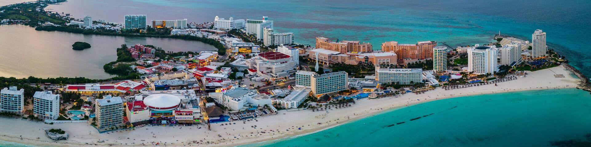 panoramic aerial of Cancun Mexico riviera Maya hotel zone at sunset Caribbean Sea tropical beach ocean view waterfront