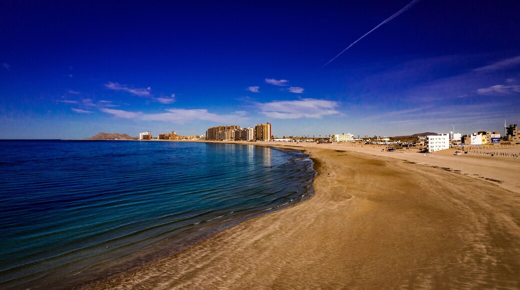 Aerial view of Sandy Beach, Puerto Penasco, Sonora, Mexico on the Sea of Cortez on a winter day with blue sky, aqua water and white clouds