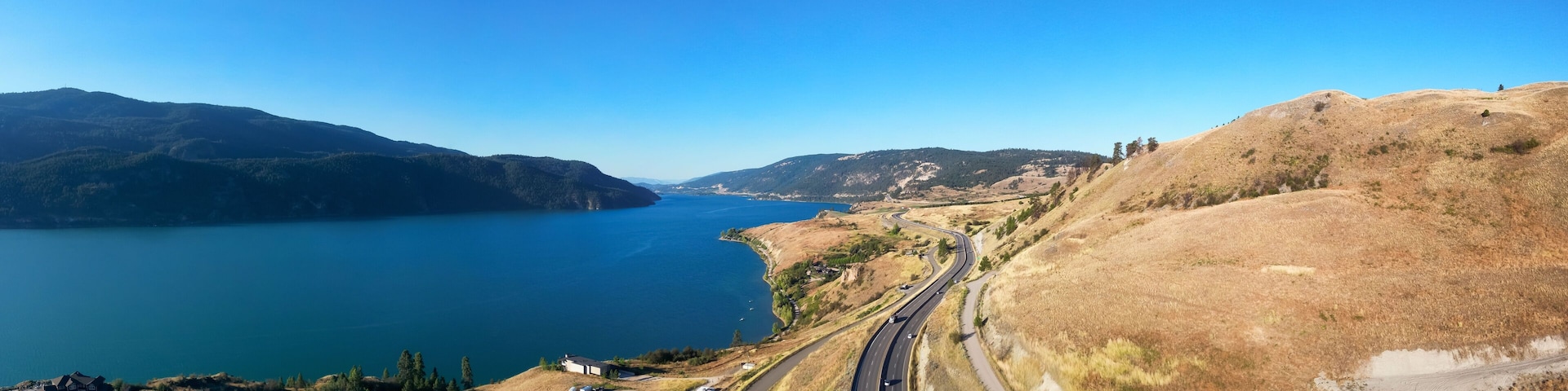Scenic Highway in the desert by the lake. Aerial View. Sunny Summer.
