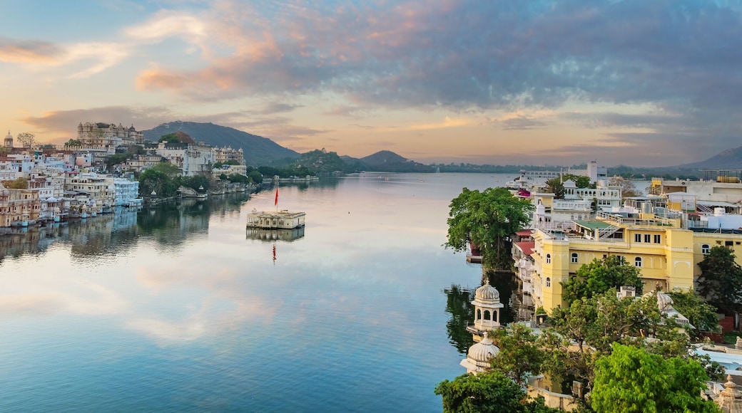 Udaipur city at lake Pichola in the morning, Rajasthan, India. View of City palace reflected on the lake.