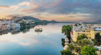 Udaipur city at lake Pichola in the morning, Rajasthan, India. View of City palace reflected on the lake.
