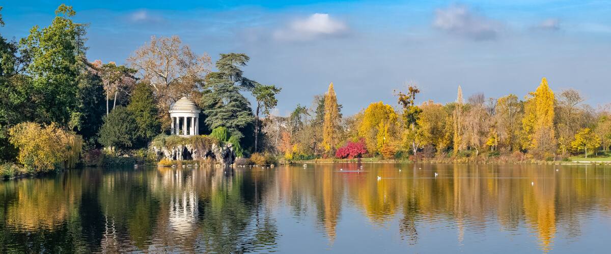 Vincennes, the temple of love and artificial grotto on the Daumesnil lake, in the public park, in autumn