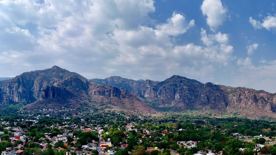 a city with mountains in the background