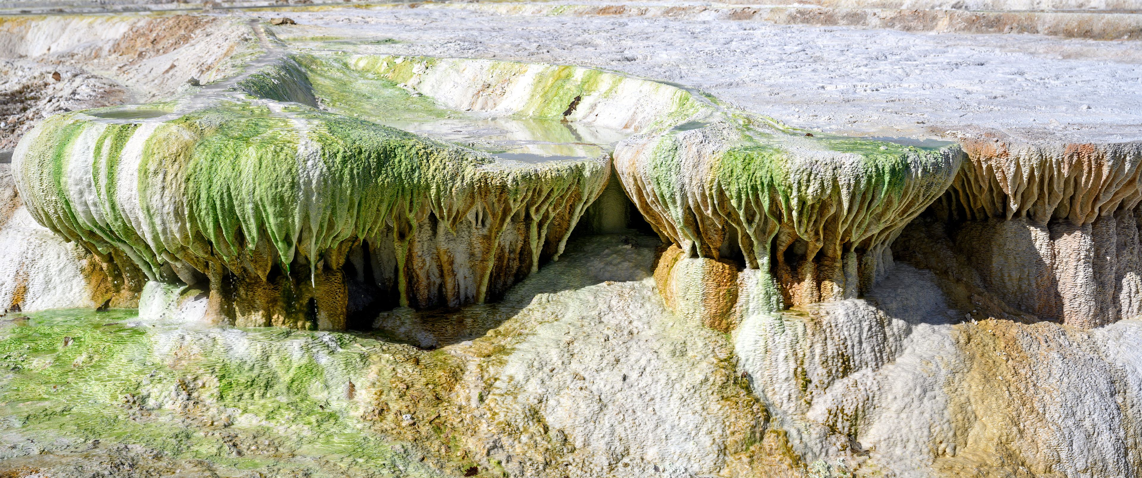 Birdseye view photo of graphic colorful mineral terraces and travertine formations in Egerszalok spa
