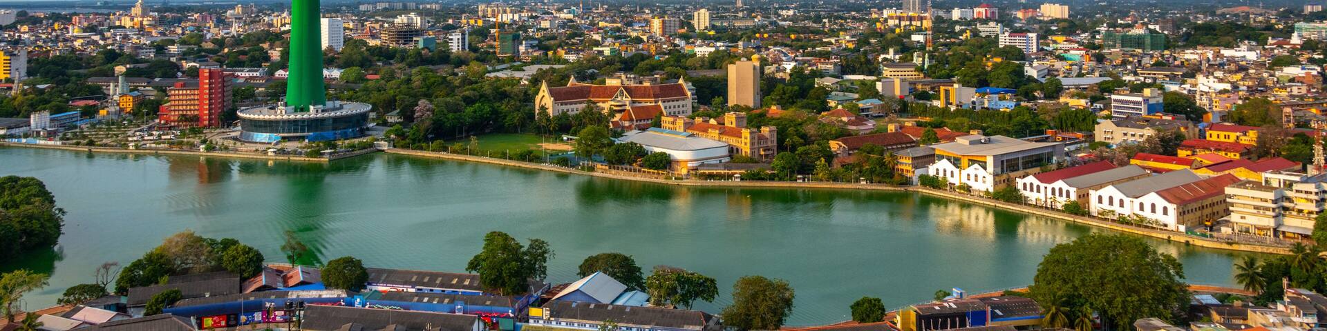 Lotus Tower and buildings along lake in downtown Colombo Sri Lanka