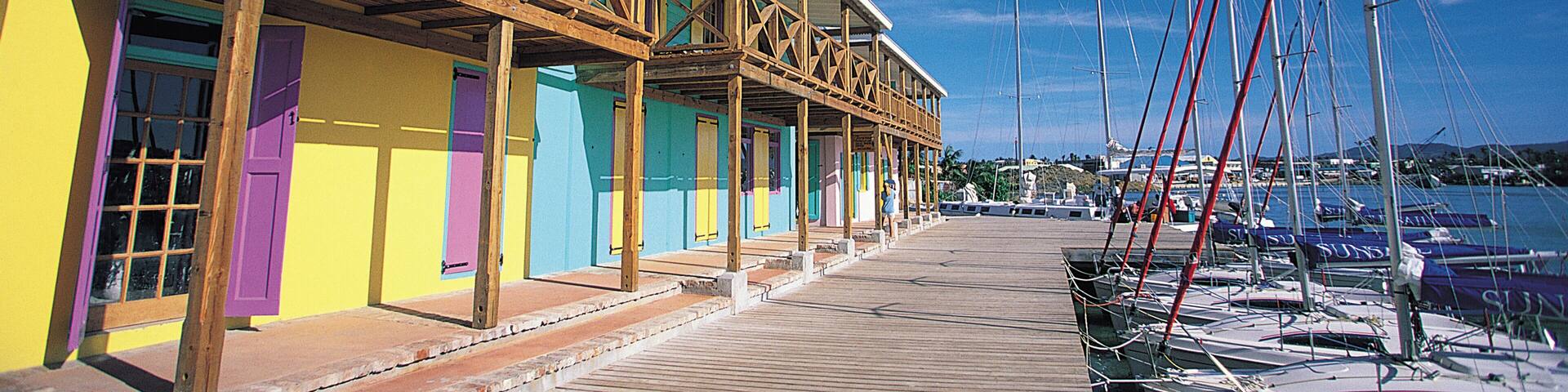 Colorful buildings facing docked boats in marina