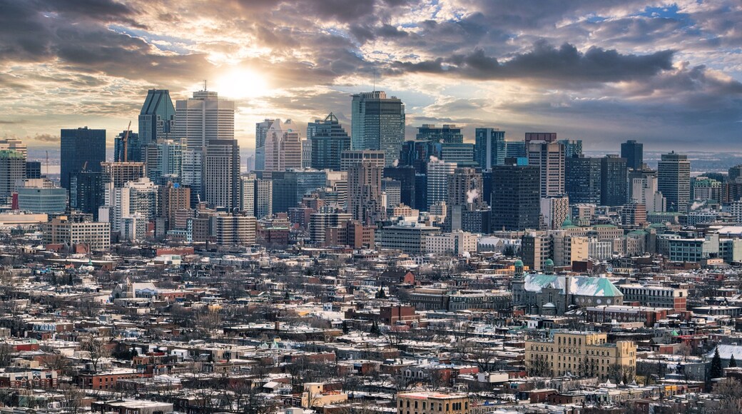 Montreal city downtown skyscrapers with sunrise behind the buildings