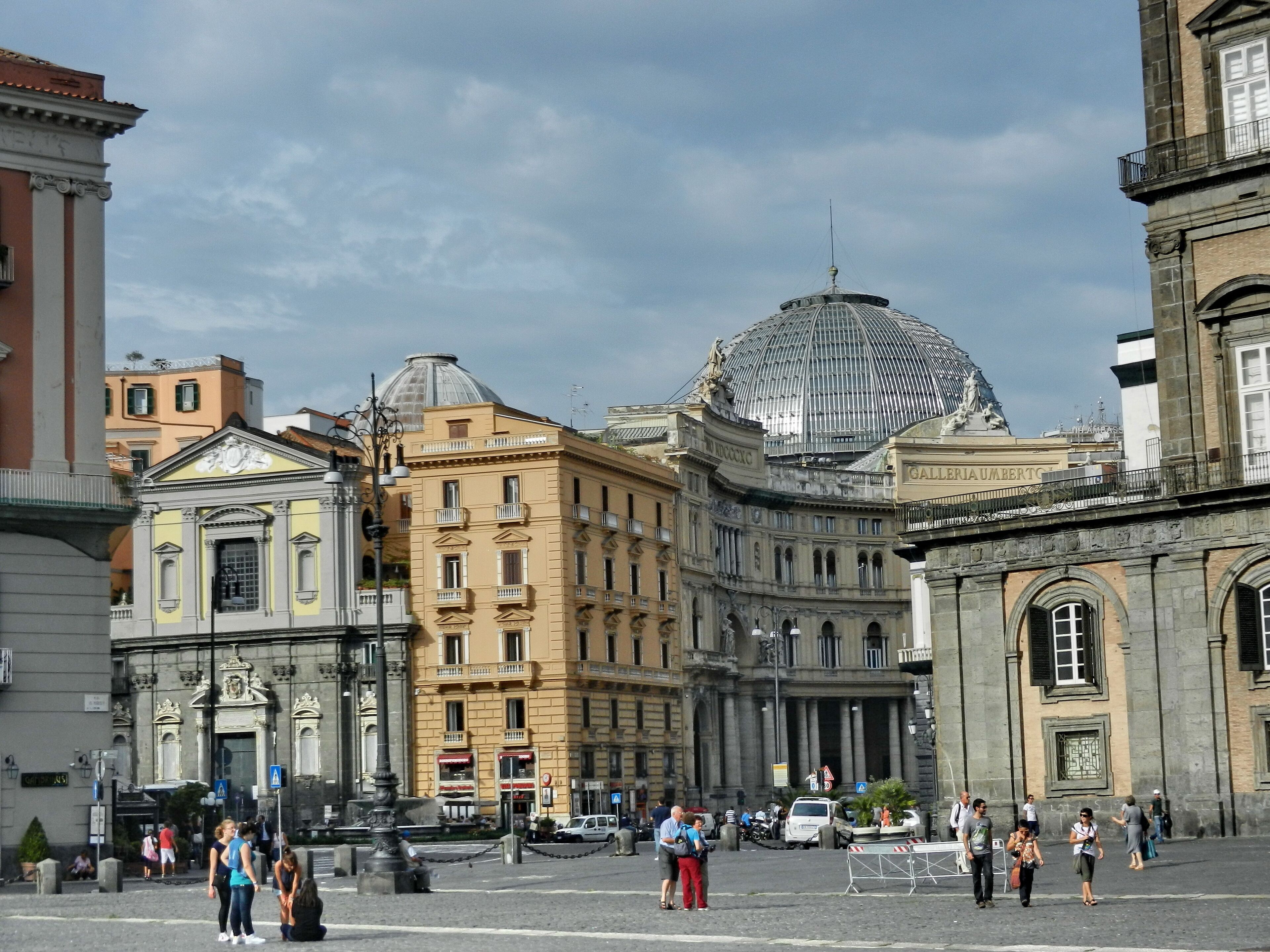 A historic square with classical architecture, including a prominent dome and ornate buildings.
