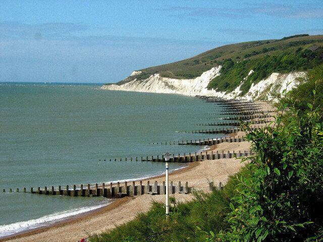 Eastbourne - Western Parade. The view which is taken from the west end of the promenade at Eastbourne looks south west along the coast to the promontory which hides Beachy Head from view.