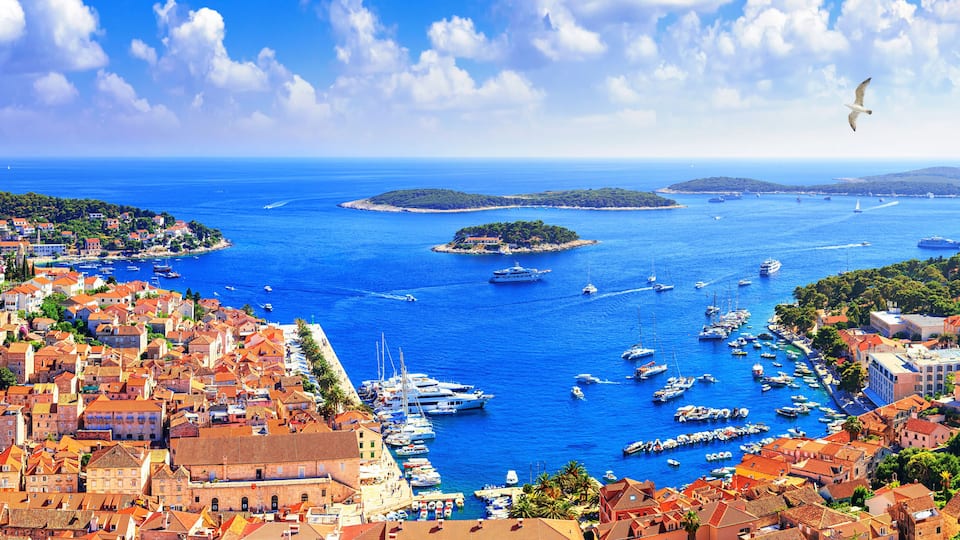 Coastal summer landscape, panorama - top view of the town of Hvar and the City Harbour with marina, on the island of Hvar, the Adriatic coast of Croatia