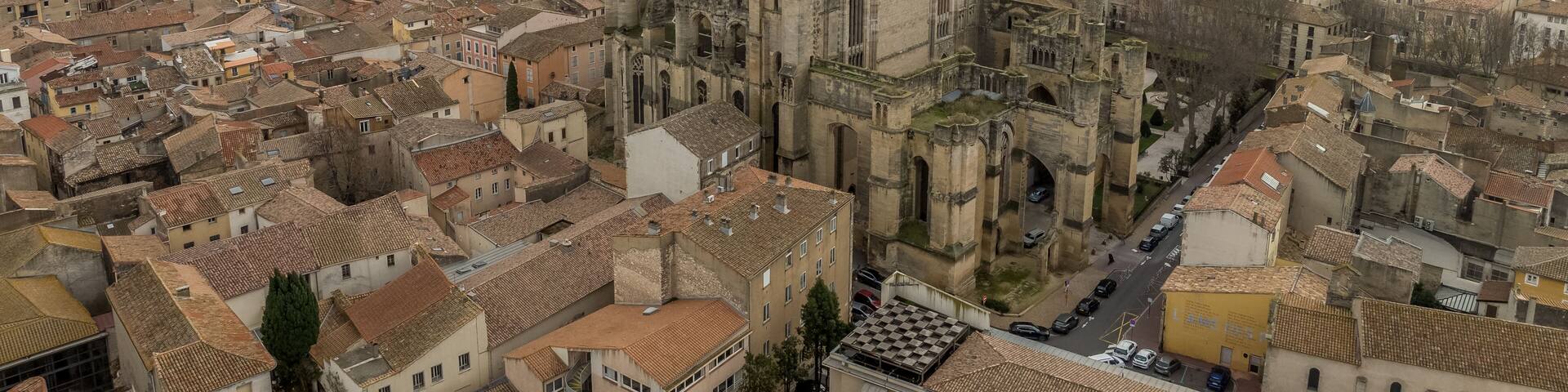 Aerial view of Narbonne France Cathédrale Saint-Just et Saint-Pasteur and Palais-Musée des Archevêques dramatic sunset view