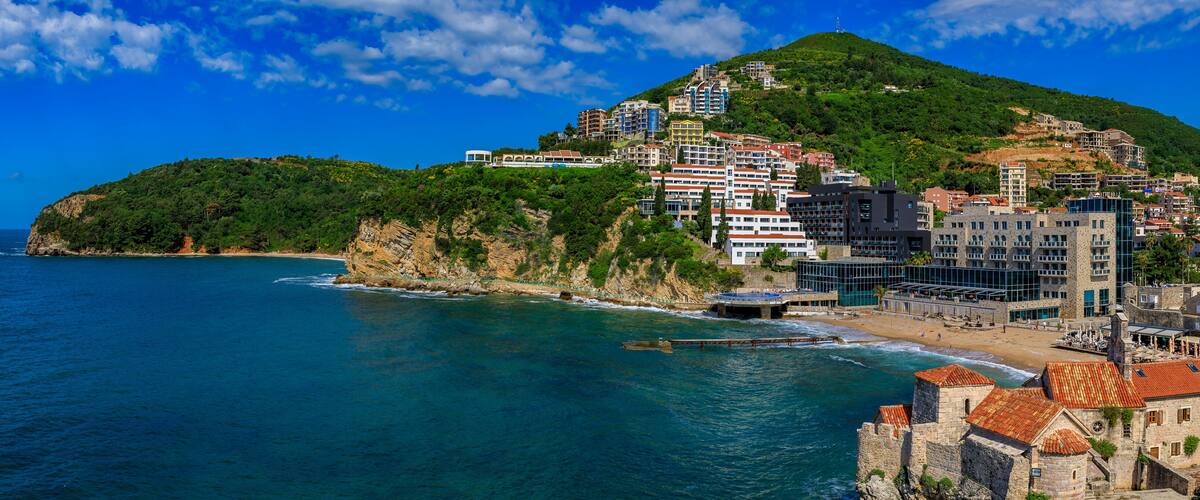 Aerial view of Budva Old Town from the Citadel with Richard’s Head beach and Adriatic Sea in Montenegro, Balkans..