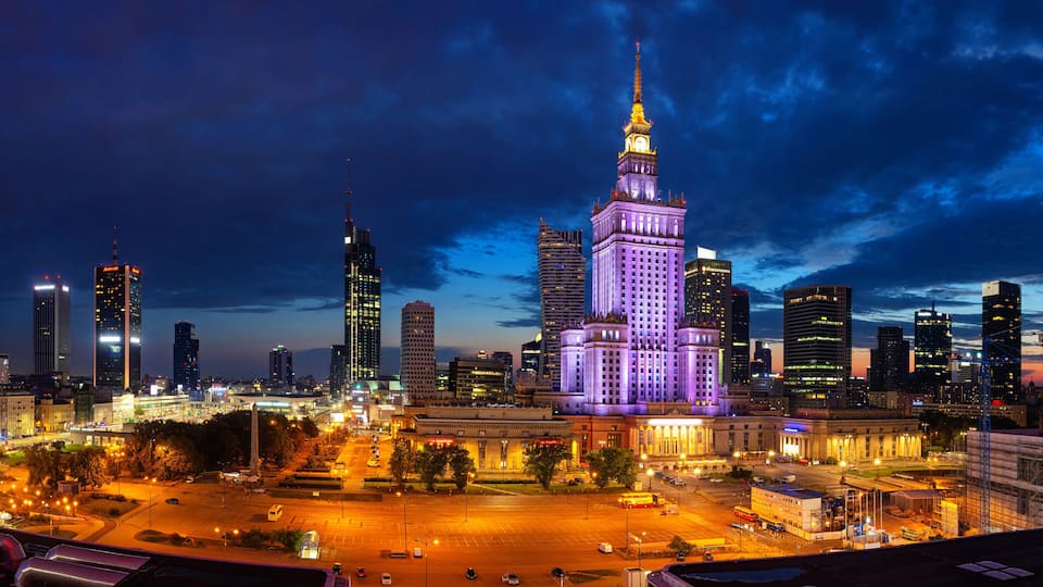 Evening cityscape with city lights - view of the Warsaw downtown and The Palace of Culture and Science. Warsaw. Poland