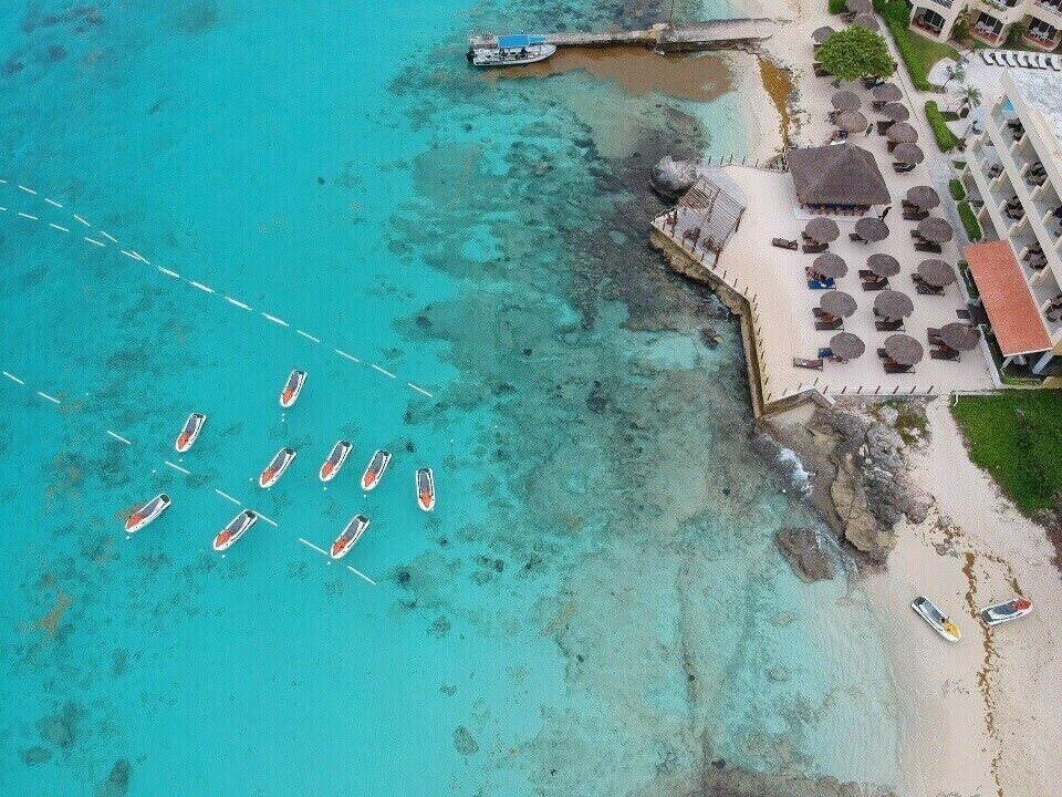 Drone shot of a beautiful beach #drone #Adventure #ocean #island #Cozumel #Mexico #island #beach #bluewater #ship #coast #seaweed #droneshot #upabove #coralreef #resort #jetski #snorkeling #seascape