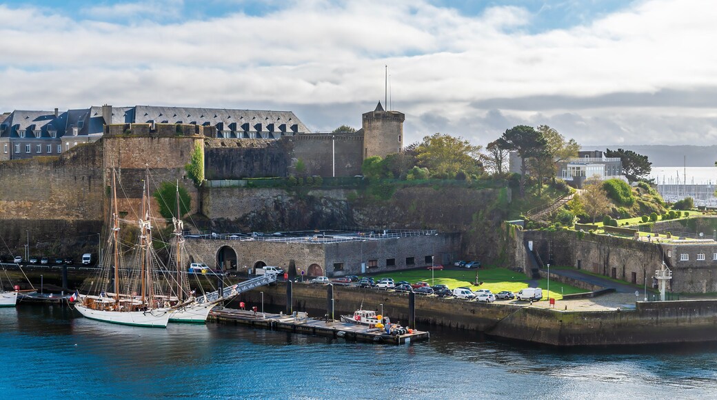 A view from the Garden of Explorers towards boats moored by the castle at Brest, France on a sunny day in autumn