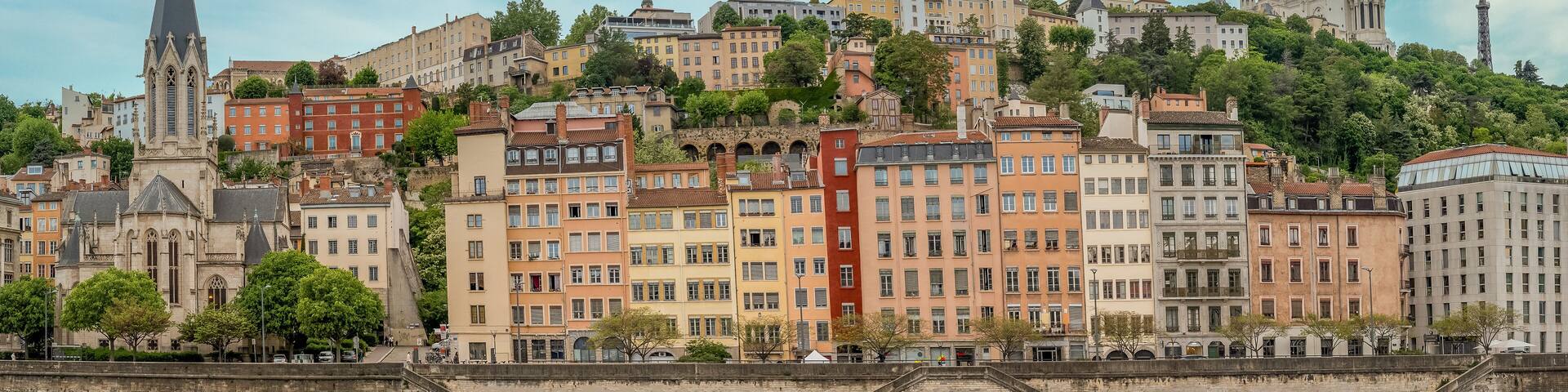 Colorful houses of Vieux Lyon on the River Saône quayside, overlooked by Renaissance-era mansions withmedieval Cathédrale Saint-Jean-Baptiste