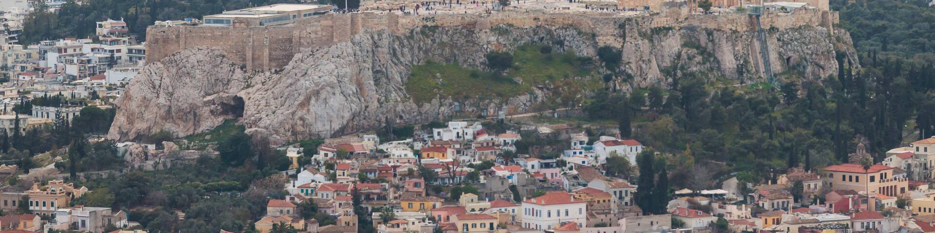 Athens, Attica, Greece, beautiful panoramic view of Athens cityscape, with The Parthenon, mountains, sea and scenery beyond the city, seen from Mount Lycabettus Hill observation deck in a sunny day