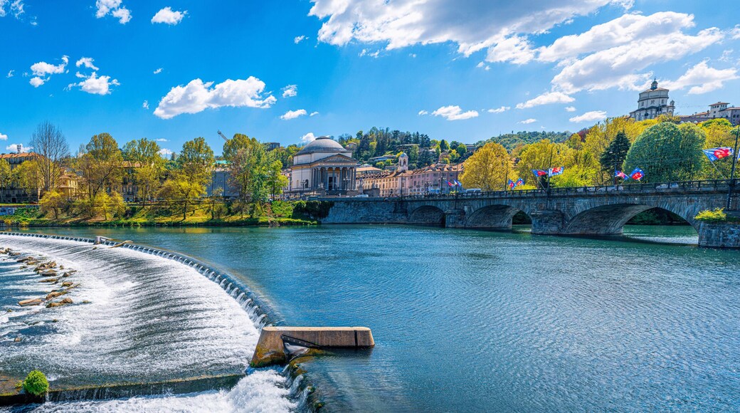 Turin Italy Panoramic view of the Po River, the Gran Madre Church, the Monte dei Cappuccini Church, and the Vittorio Emanuele I Bridge in Torino, the capital city of Piedmont