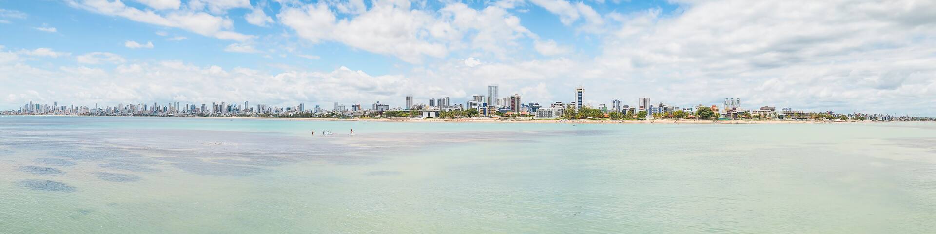 Panoramic view of Praia do Bessa beach and the city of Joao Pessoa. Seafront buildings view. Caribessa, near corals.