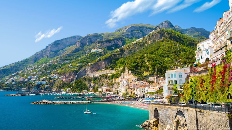 Morning view of Amalfi cityscape on coast line of mediterranean sea, Italy