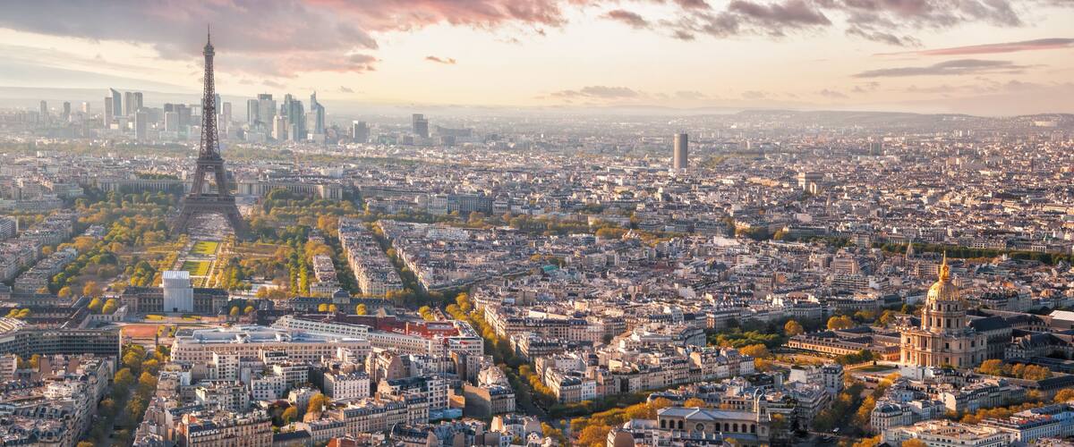 Panorama of Paris with Eiffel Tower against sunset in France