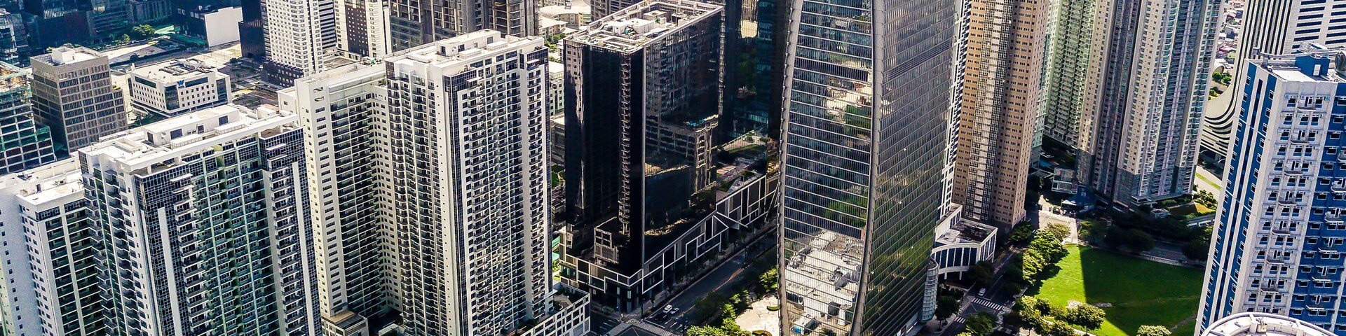 Taguig, Metro Manila, Philippines - The BGC skyline during a clear sunny day.