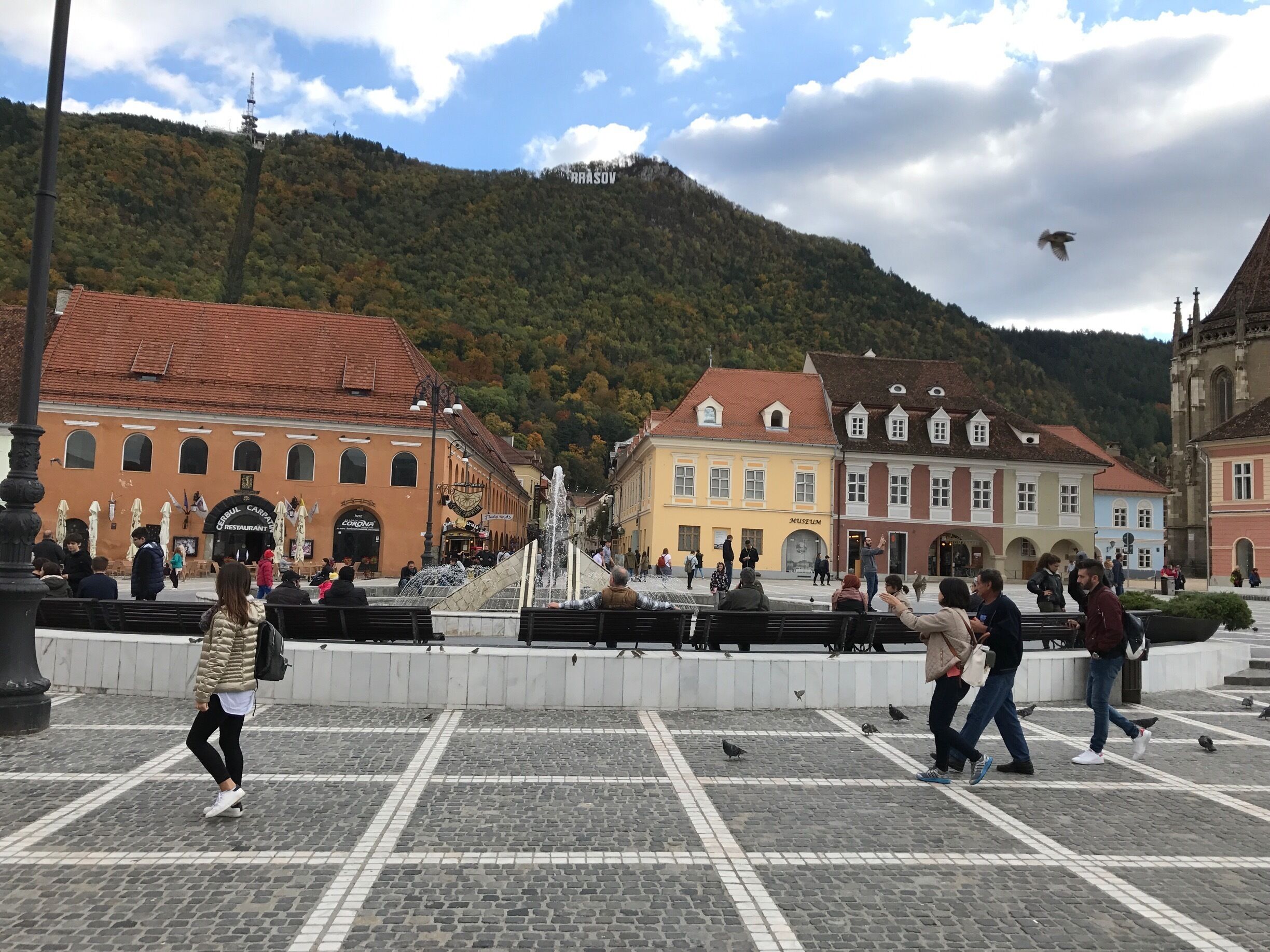 The main square of Brasov overlooked by its attempt at the Hollywood hills sign 
