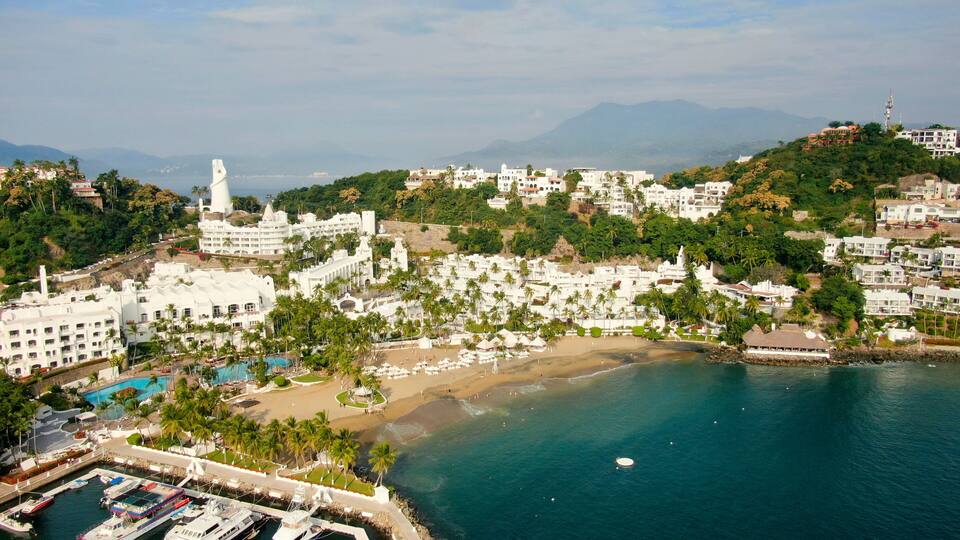 Manzanillo, Mexico - 11.21.2022 Aerial view of Peninsula de Santiago in city Manzanillo, Mexico. Beautiful bitch and luxury hotels
