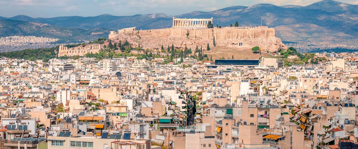 The Acropolis Hill with the Parthenon and the Athens skyline, seen from Kynosargous Hill. Athens, Greece.