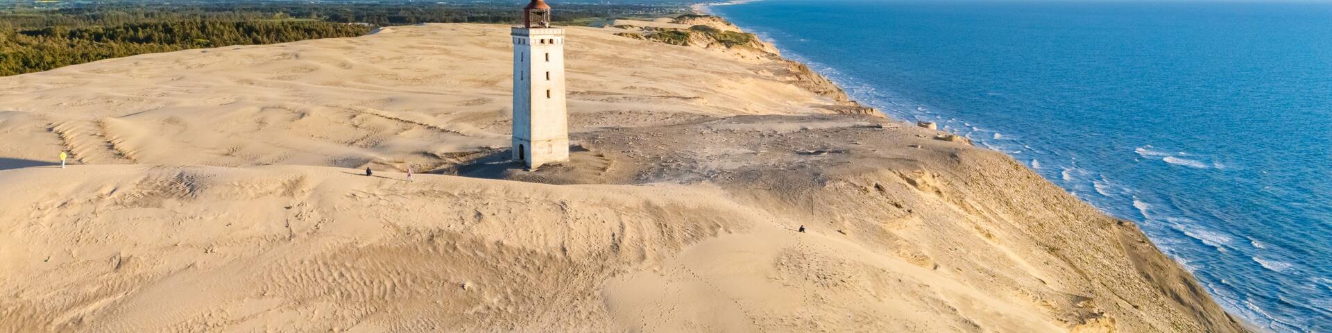 Explore the stunning coastal landscape of Denmark near the iconic lighthouse at Skagen