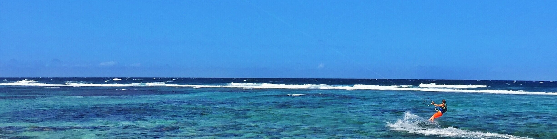 It is a very nice and quiet beach but also with entertainment because of the many kite surfers passing by. It is still a great spot to swim even though it is on the north shore with big waves but they do not get all the way to the shore. The waters are crystal #blue and the sand is a bit of pink. The entrance is a bit hidden by the Grapefield dunes.