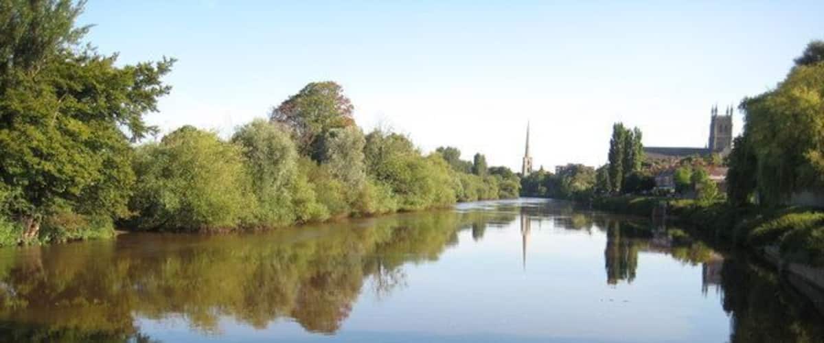The River Severn at Diglis View up the River Severn from where the Worcester and Birmingham Canal enters the Severn at Diglis. Worcester Cathedral can be seen on the right and St Andrew's Spire is reflected in the calm waters of the river.