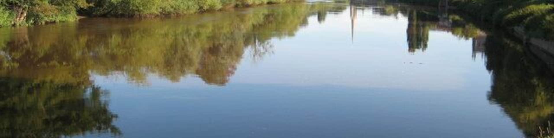 The River Severn at Diglis View up the River Severn from where the Worcester and Birmingham Canal enters the Severn at Diglis. Worcester Cathedral can be seen on the right and St Andrew's Spire is reflected in the calm waters of the river.