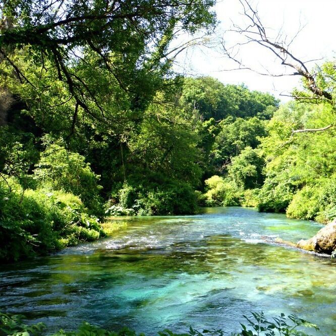 The Blue Eye in Albania is one of the most beautiful sights. Crystal clear water bubbles up from at least 50 m deep as the deep blue center of a spring. 

Surrounding this spring is lush foliage along the rushing river. Definitely a place to visit if you are traveling between Saranda and Gjirokastra. 