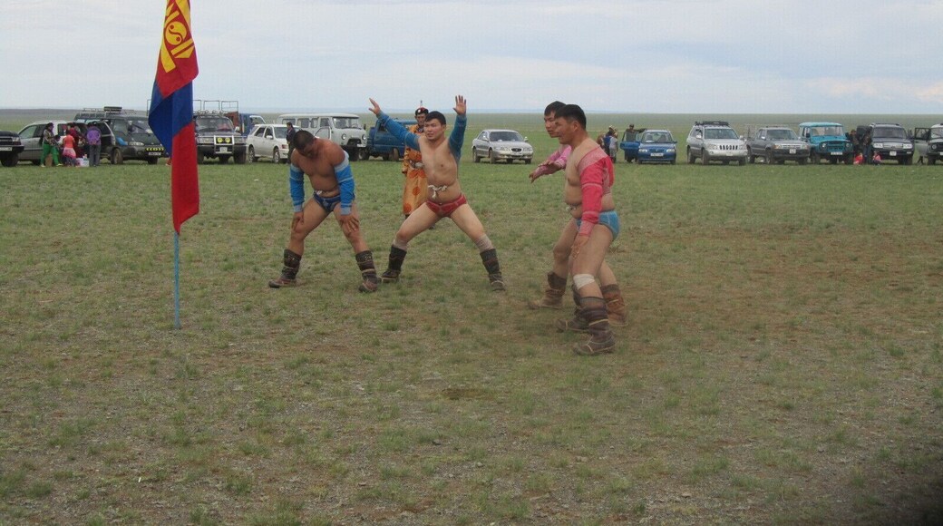 After a wrestling match the victors perform the eagle dance around the flag. We were lucky enough to go to a very small nadaam while we were in the Gobi Desert. The nadaam has wrestling, archery and a cross-country horse race. #Gobi Desert