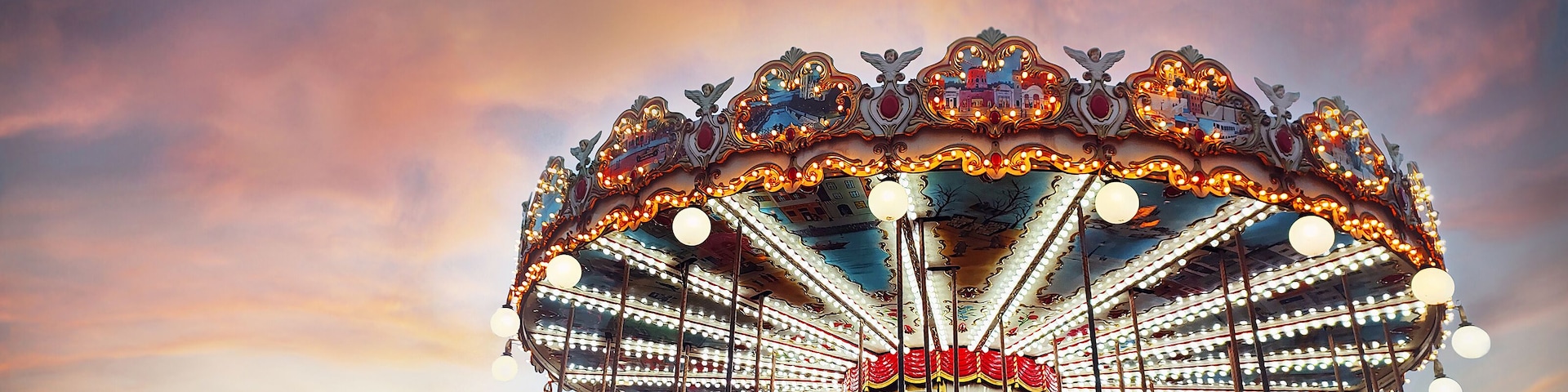 Part of popular vintage carousel (merry-go-round) by the Eiffel Tower in Paris on sky sunset background. France. Copy space. Empty space for message.