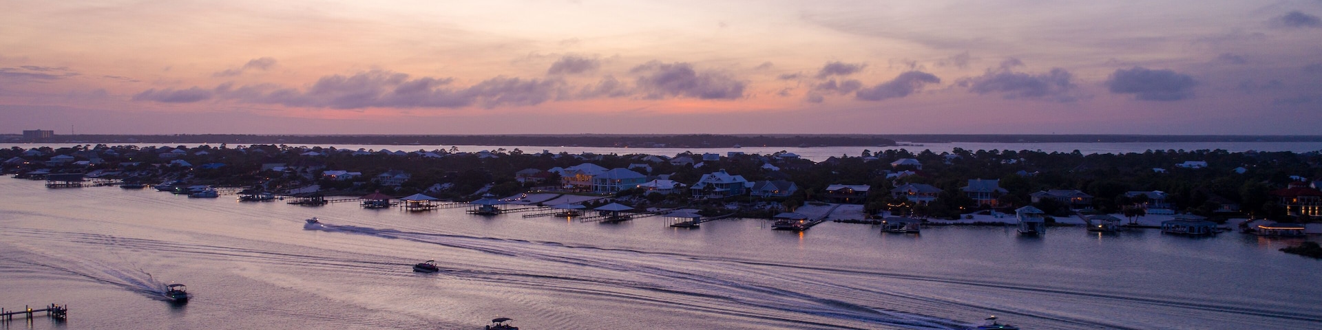 Aerial view of Ono Island and boats at sunset