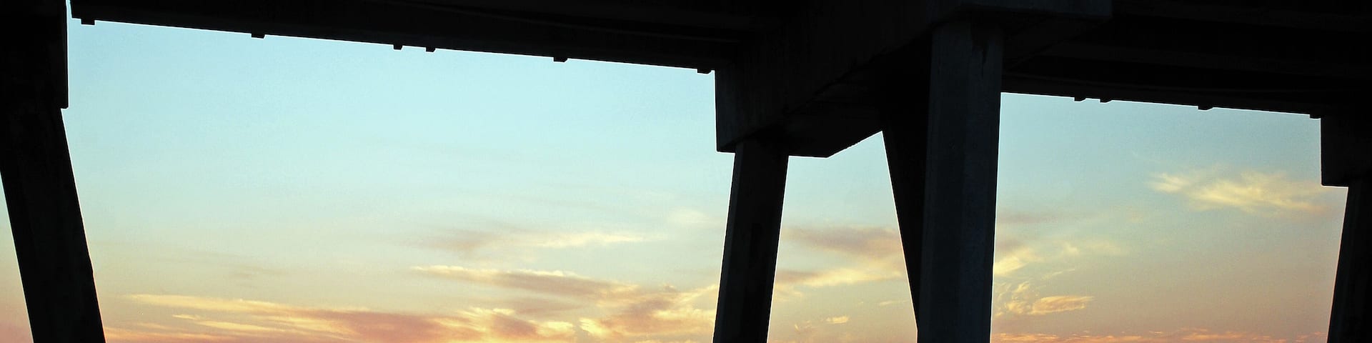 The sun rise, as seen from under the pier