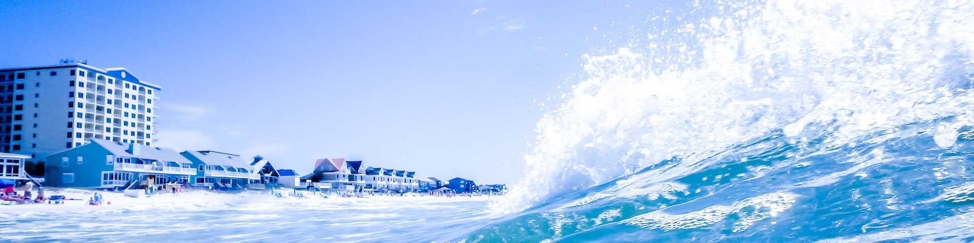 blue crystal water waves crashing on beach