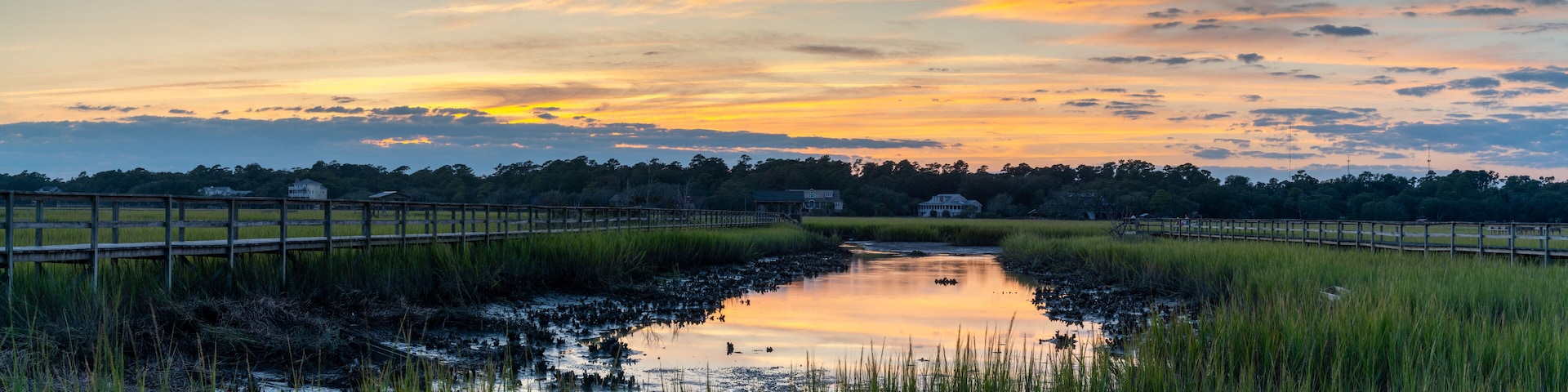 panorama landscape of tidal beds and marshlands in Pawleys Island in South Carolina at sunset