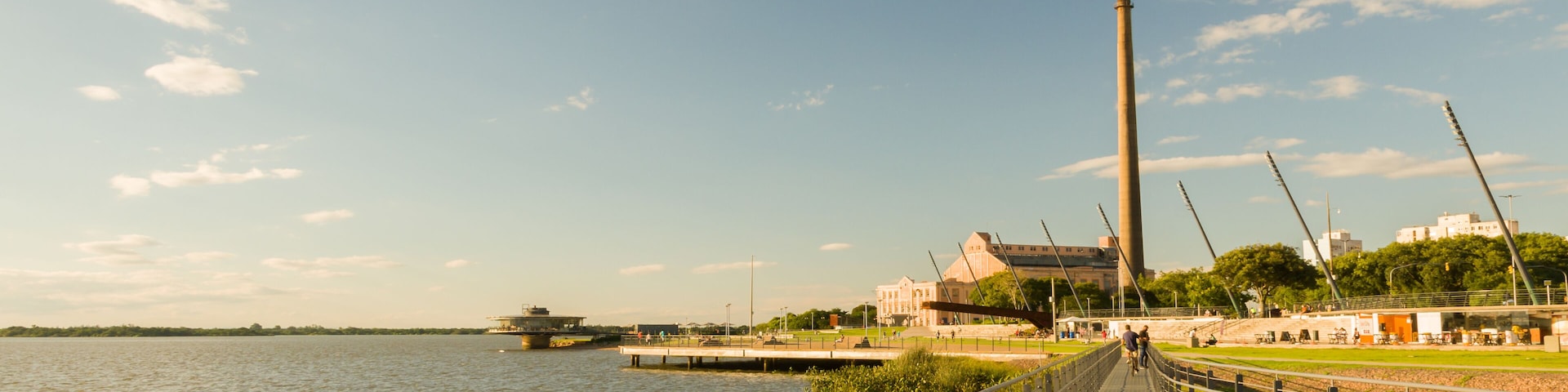 Porto Alegre, Rio Grande do Sul, Brazil, March 29 - 2021: Beautiful sunset on the edge of Guaíba, Gasometro at golden hour