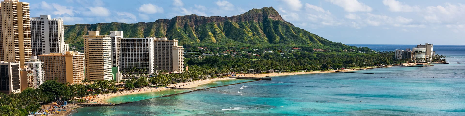 Hawaii panoramic Honolulu city travel landscape banner background of Waikiki beach and Diamond Head mountain peak at sunset, Oahu island, USA vacation.