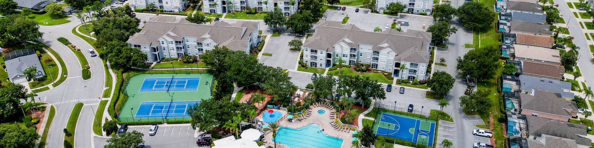 Aerial Drone Shot of Jersey City with Manhattan Skyline on Cloudy Day