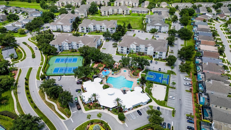 Aerial Drone Shot of Jersey City with Manhattan Skyline on Cloudy Day