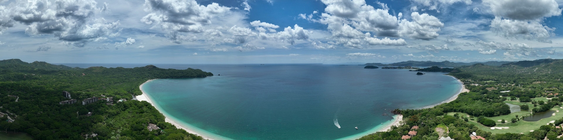 Playa Conchal, in Guanacaste, Costa Rica, is a stunning beach known for its unique seashell-covered shores, crystal-clear waters, and lush surroundings, perfect for a tropical escape.