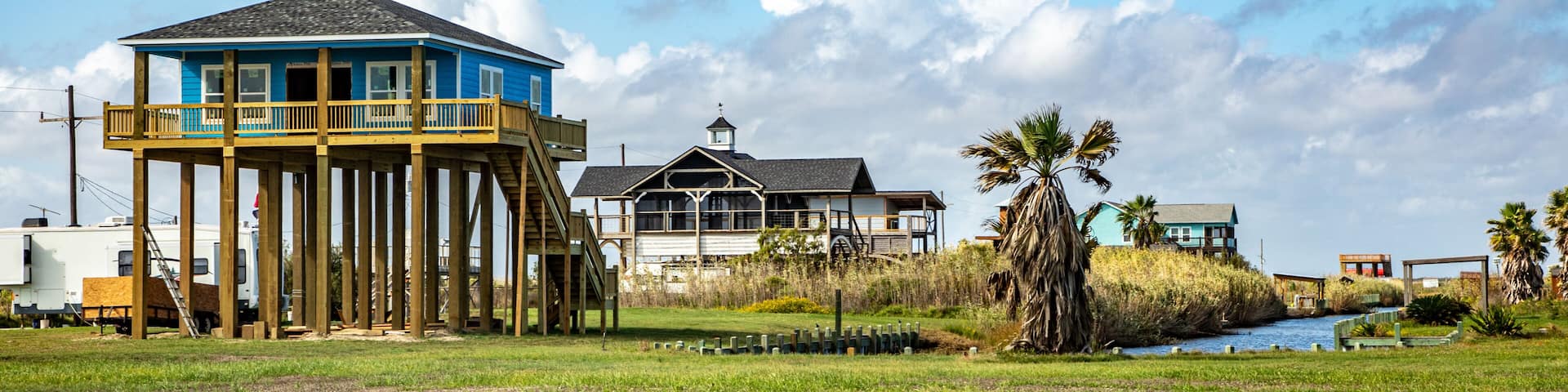 new beach house at Port Bolivar on wooden stilts to protect against flooding, Texas