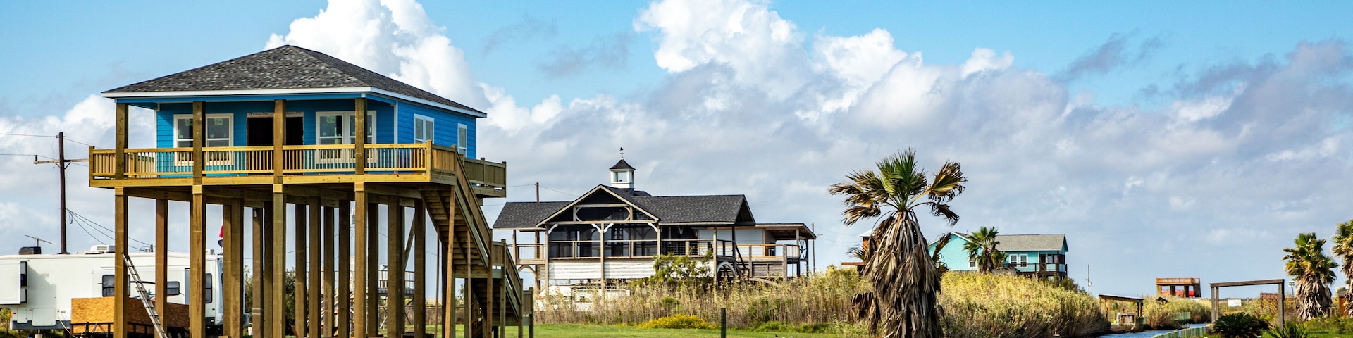 new beach house at Port Bolivar on wooden stilts to protect against flooding, Texas