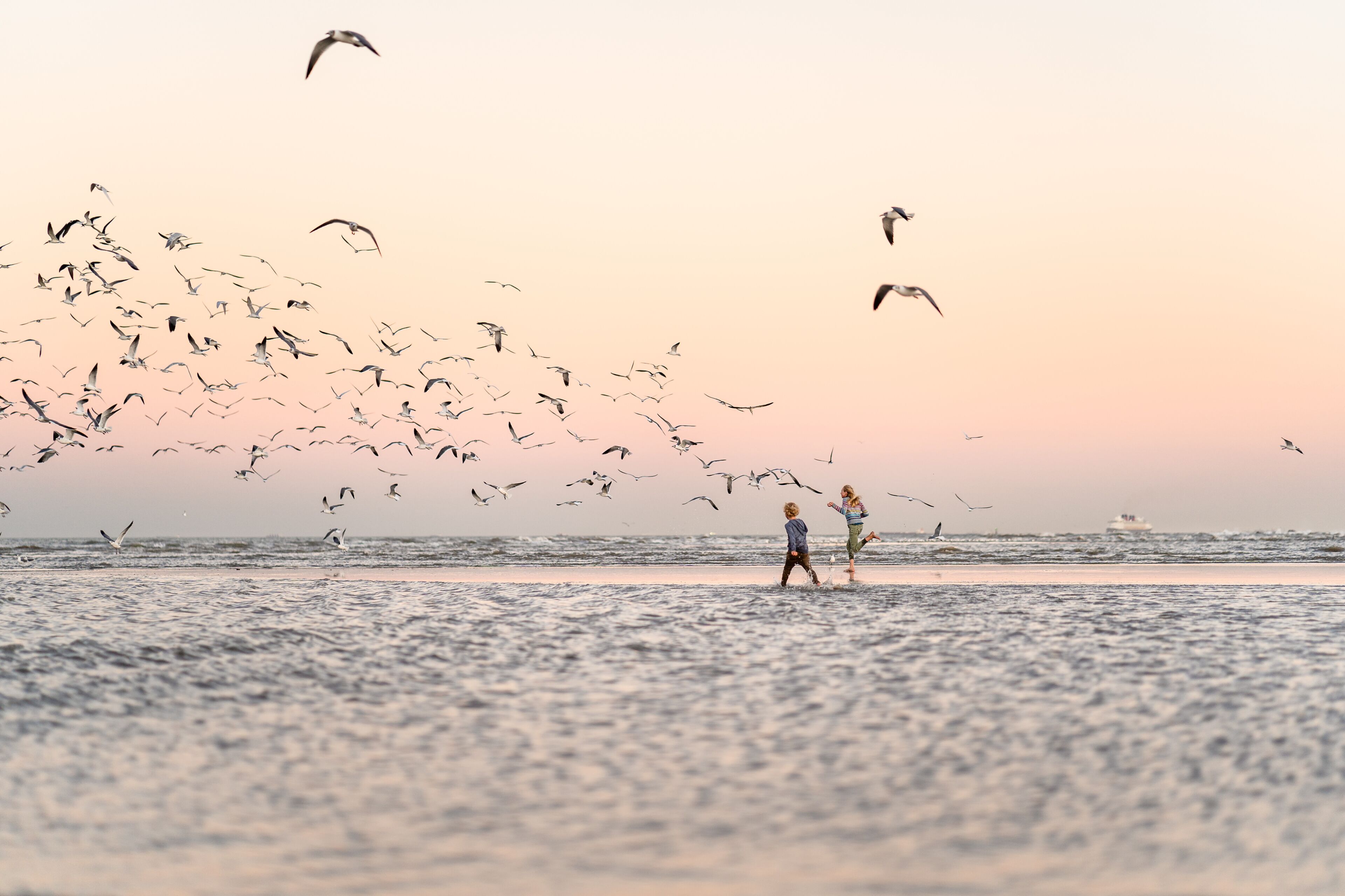 Two children on Texas beach at dusk